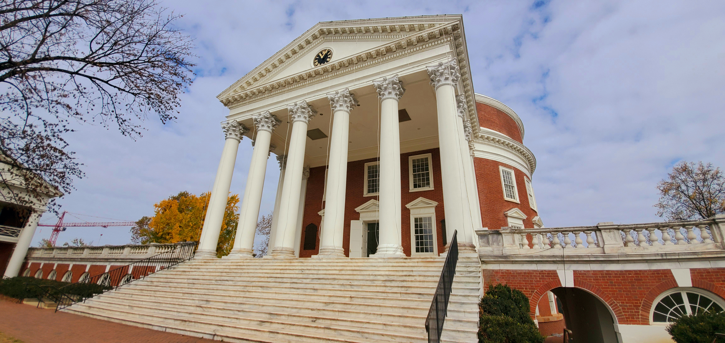 Historic building with columns and steps.