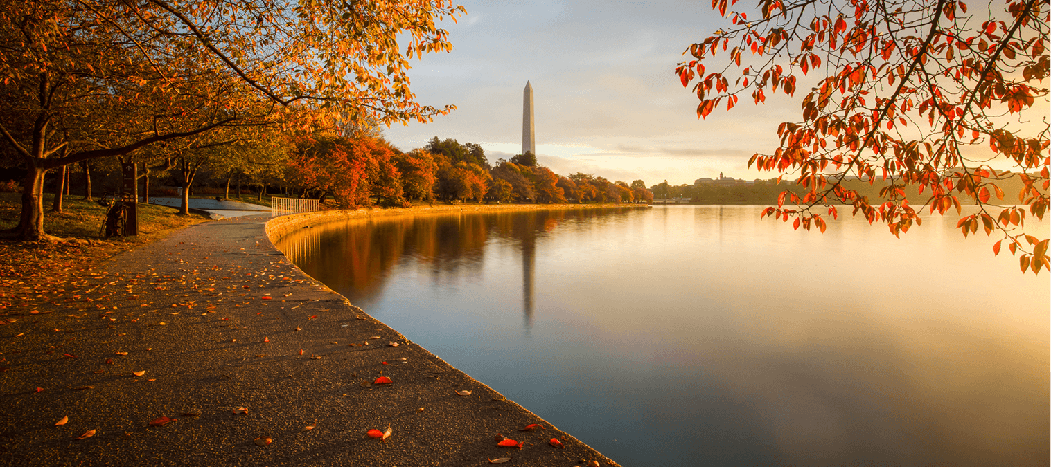 Autumn scene by a lake and monument.