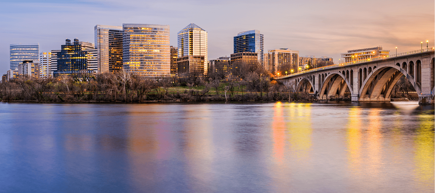 City skyline with river and bridge.