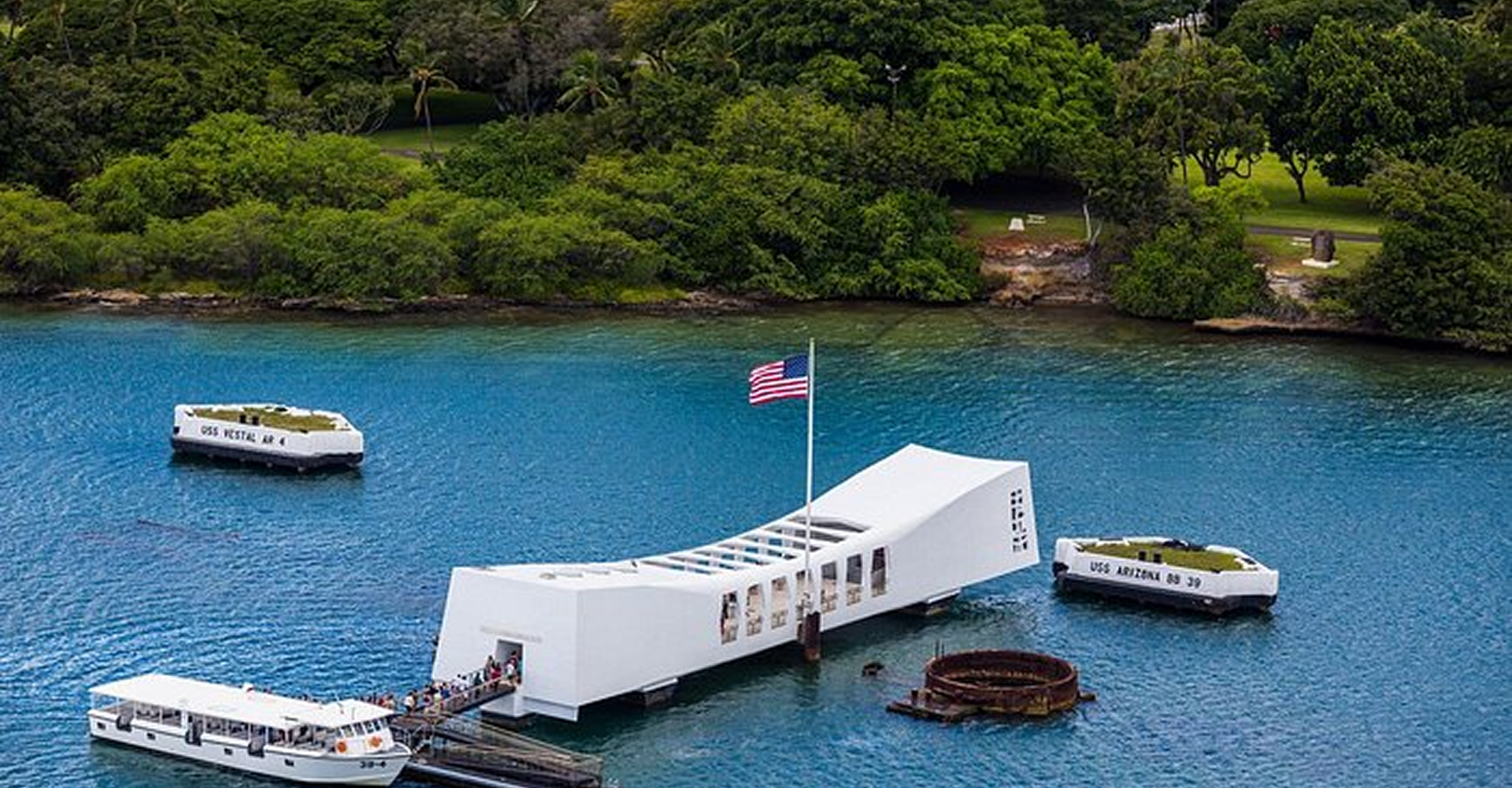 USS Arizona Memorial with surrounding boats.