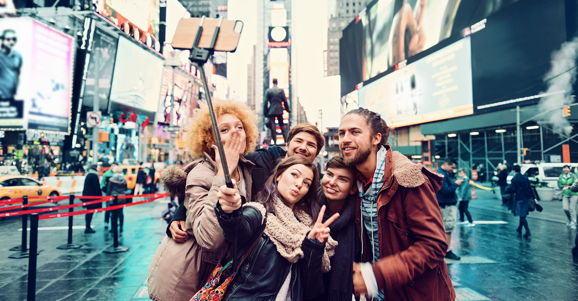 Group taking selfie in Times Square.