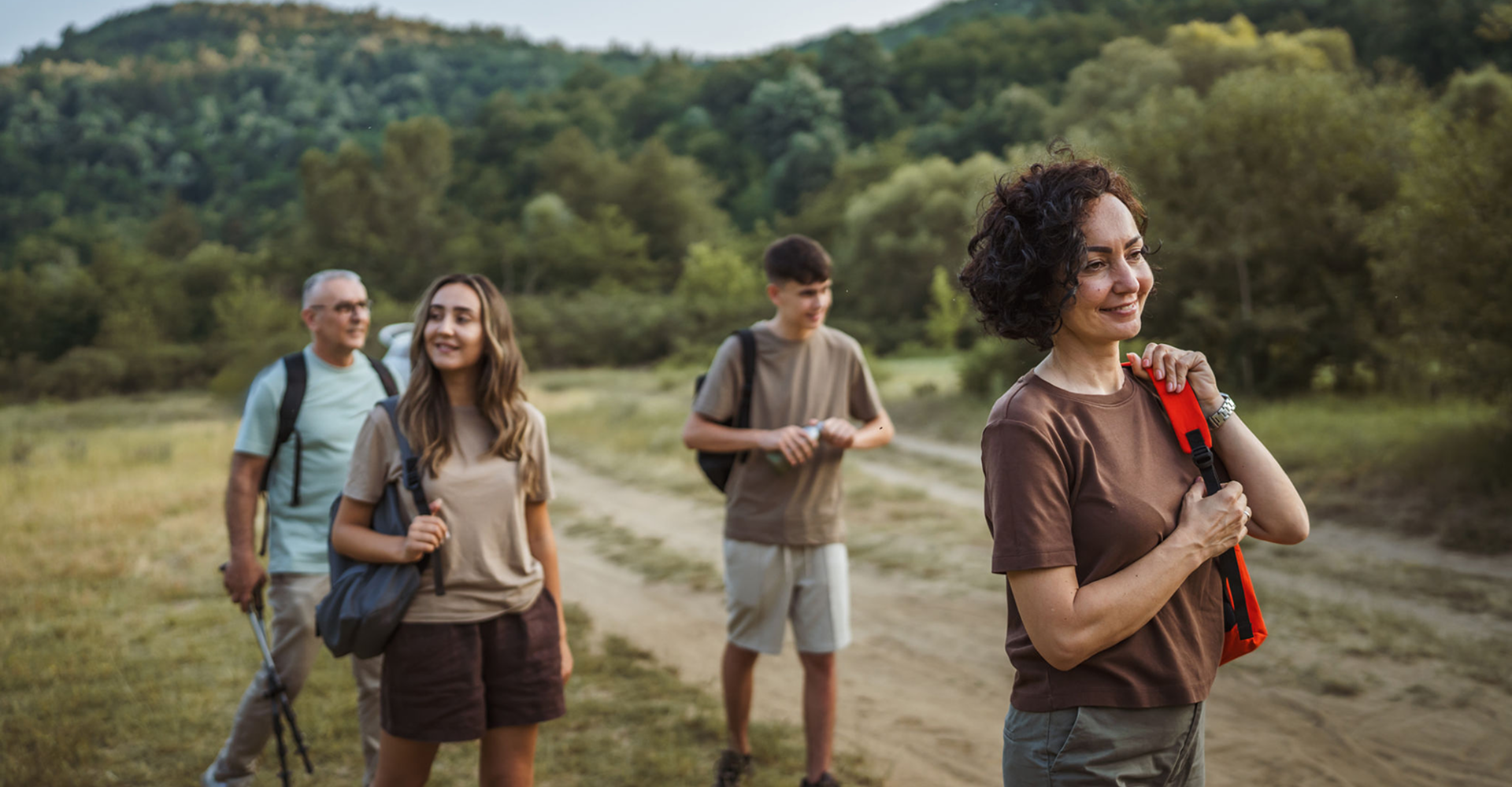 Family hiking on a forest trail together.