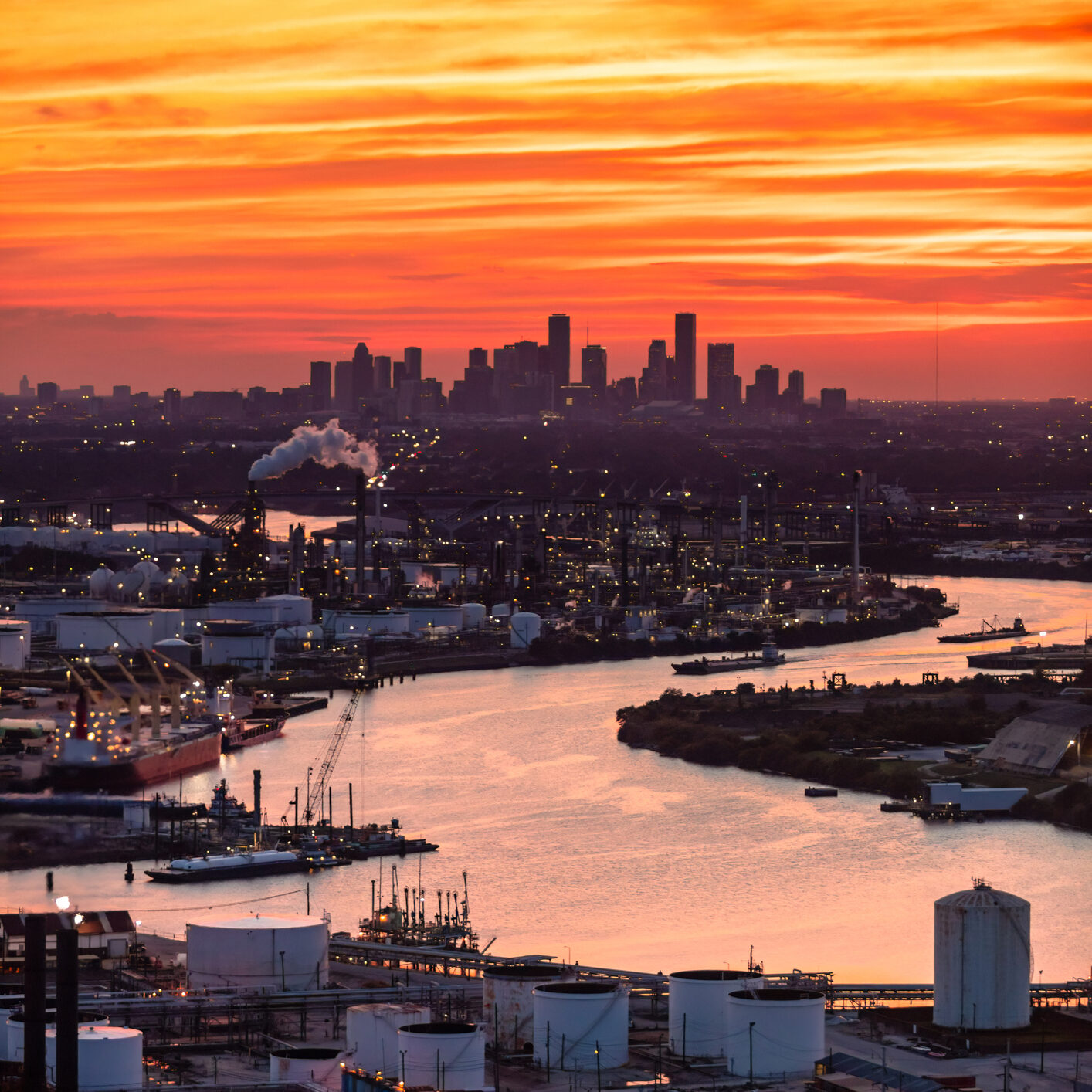 An aerial shot of the industrial area in Houston, Texas on a warm Summer sunset.